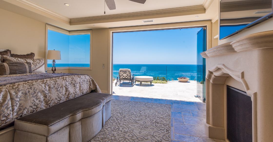 Luxurious bedroom with frameless glass doors