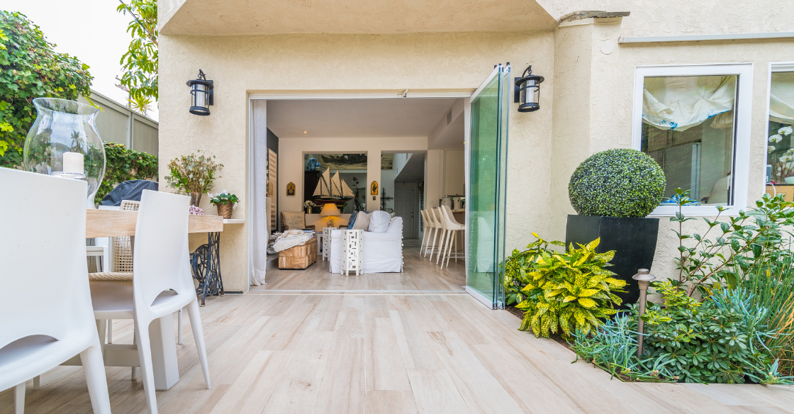 Cover Glass frameless doors leading out to a patio