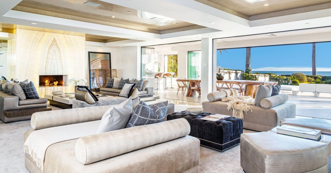 Living room with frameless glass doors fully opened