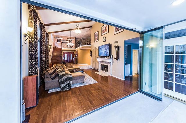 Transitional Living Room with Frameless Glass Doors