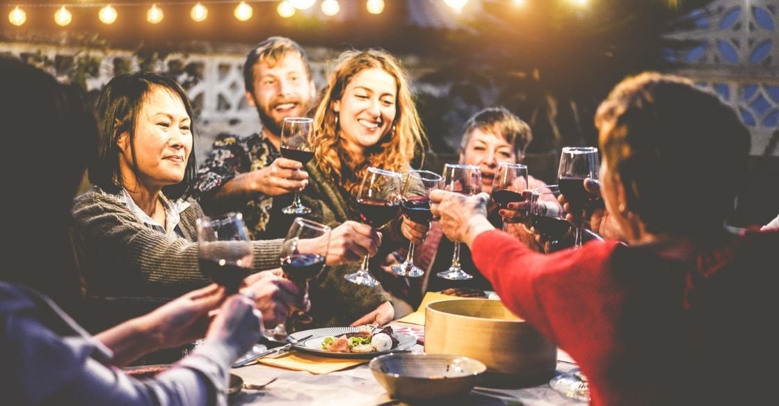 Friends and family enjoying a backyard dinner