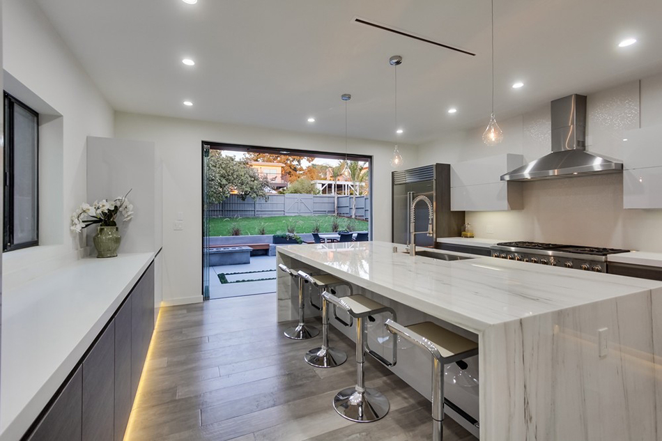 image of kitchen with open patio doors