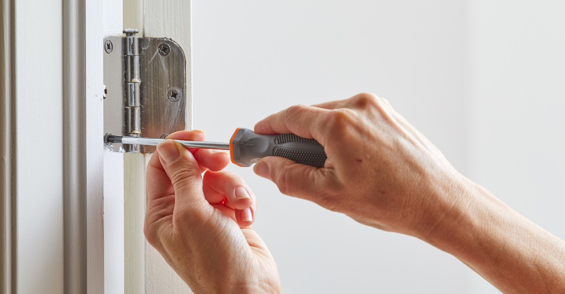 person tightening their patio door hinges