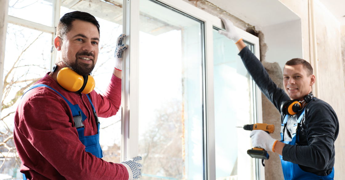 Two men installing windows