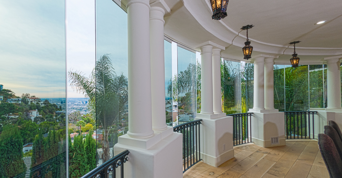 Frameless windows adding architectural detail to a patio