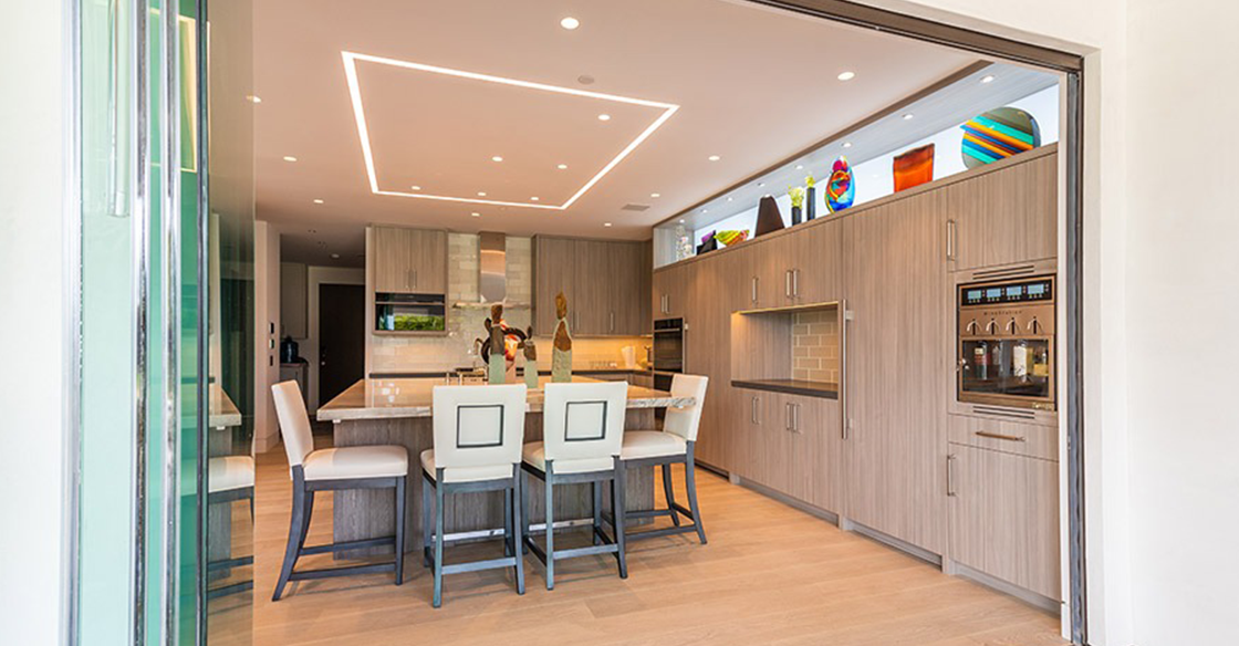 Modern kitchen with patio doors fully open